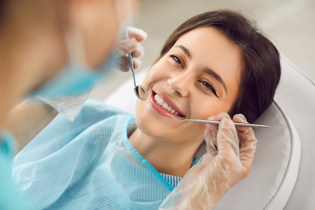 Smiling patient with Zirconium Porcelain veneers at Natural Clinic in Turkey