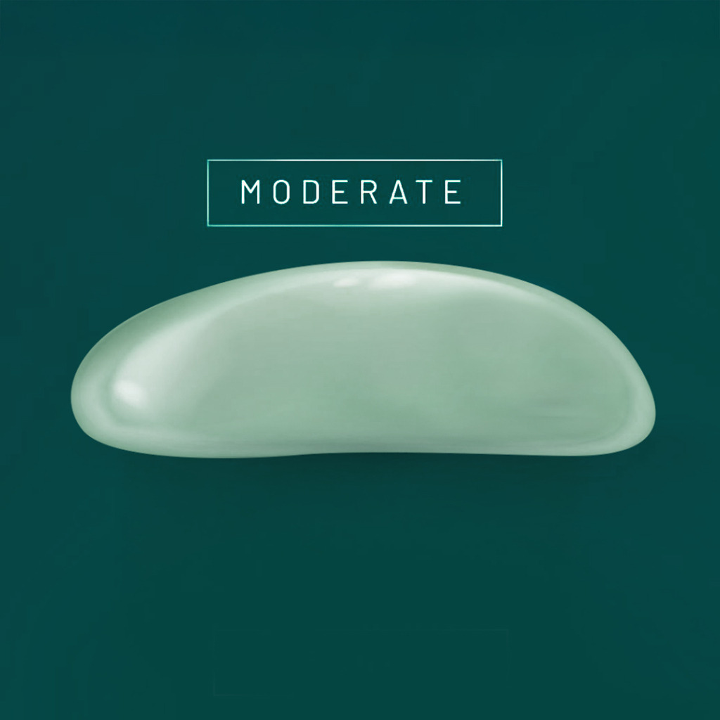 Moderate-profile breast implant for balanced enhancement