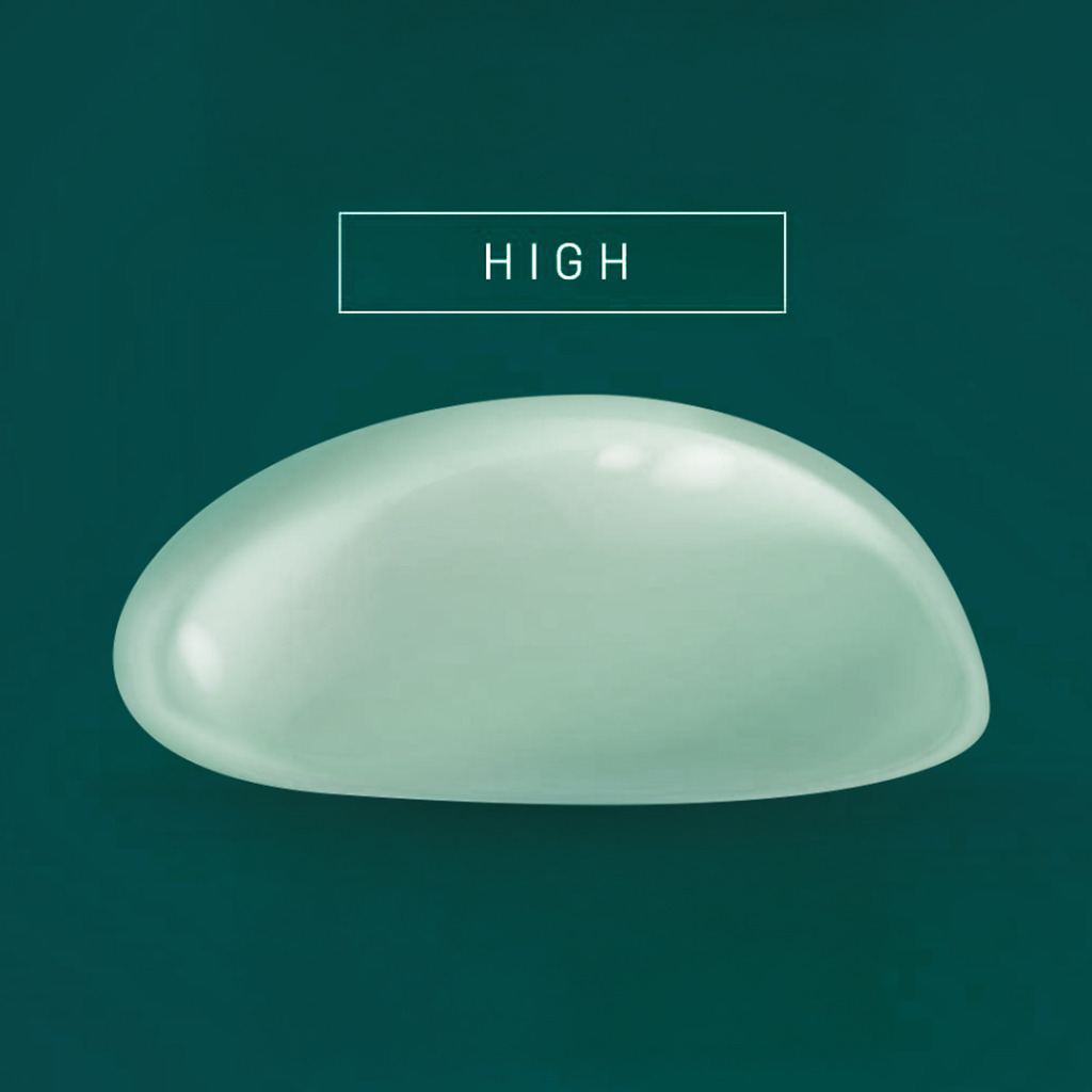 Textured surface breast implant for better tissue adherence