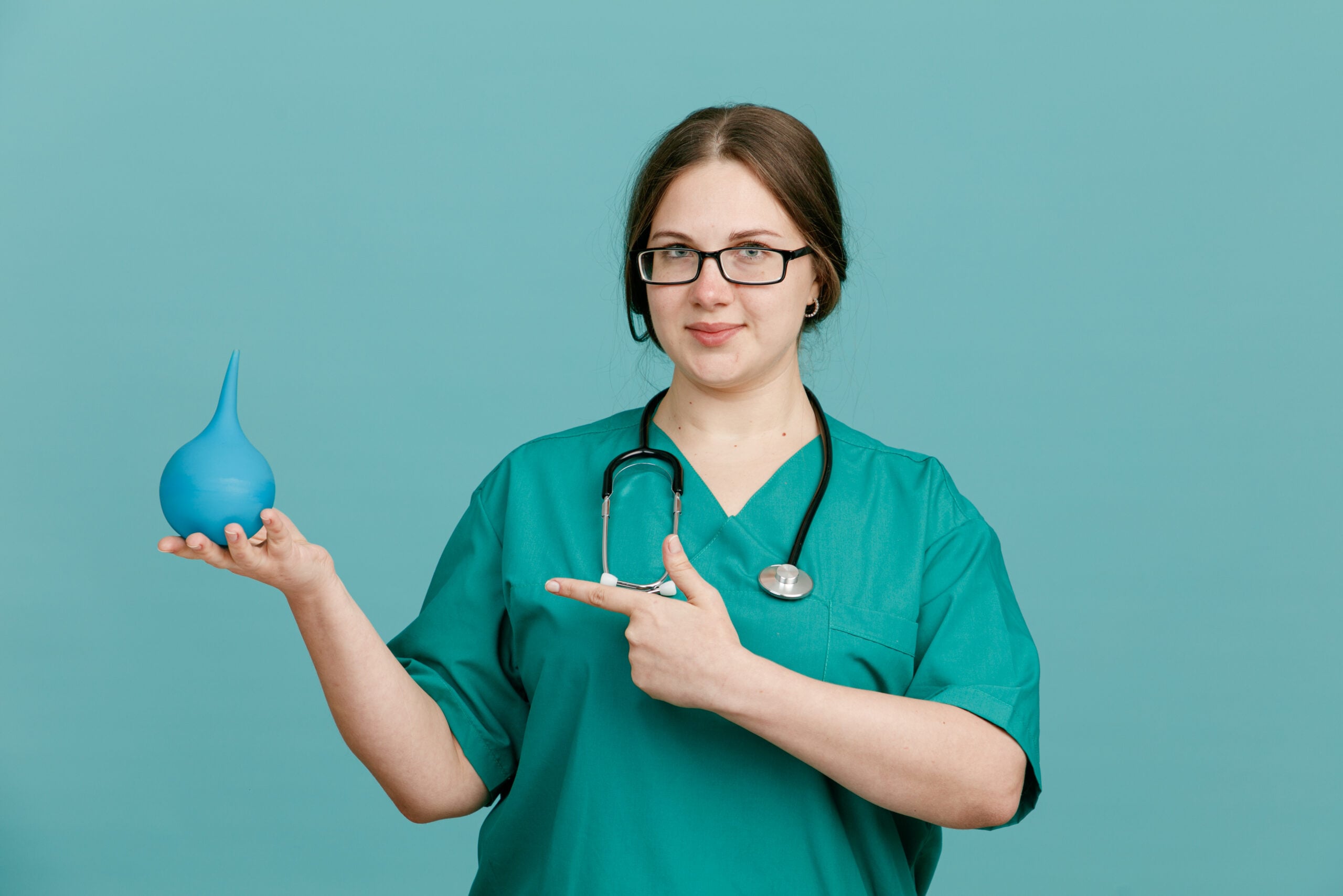Doctor holding gastric balloon device for non-surgical weight loss treatment in Turkey
